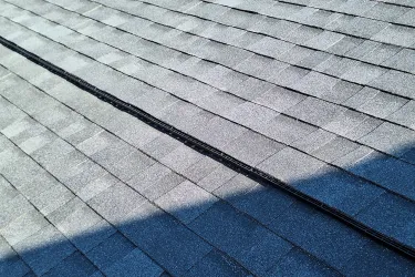 Close view of an asphalt shingle roof installation