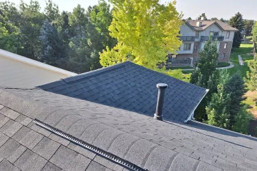 Multi-plane asphalt shingle roof after installation